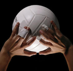 Hands on a volleyball